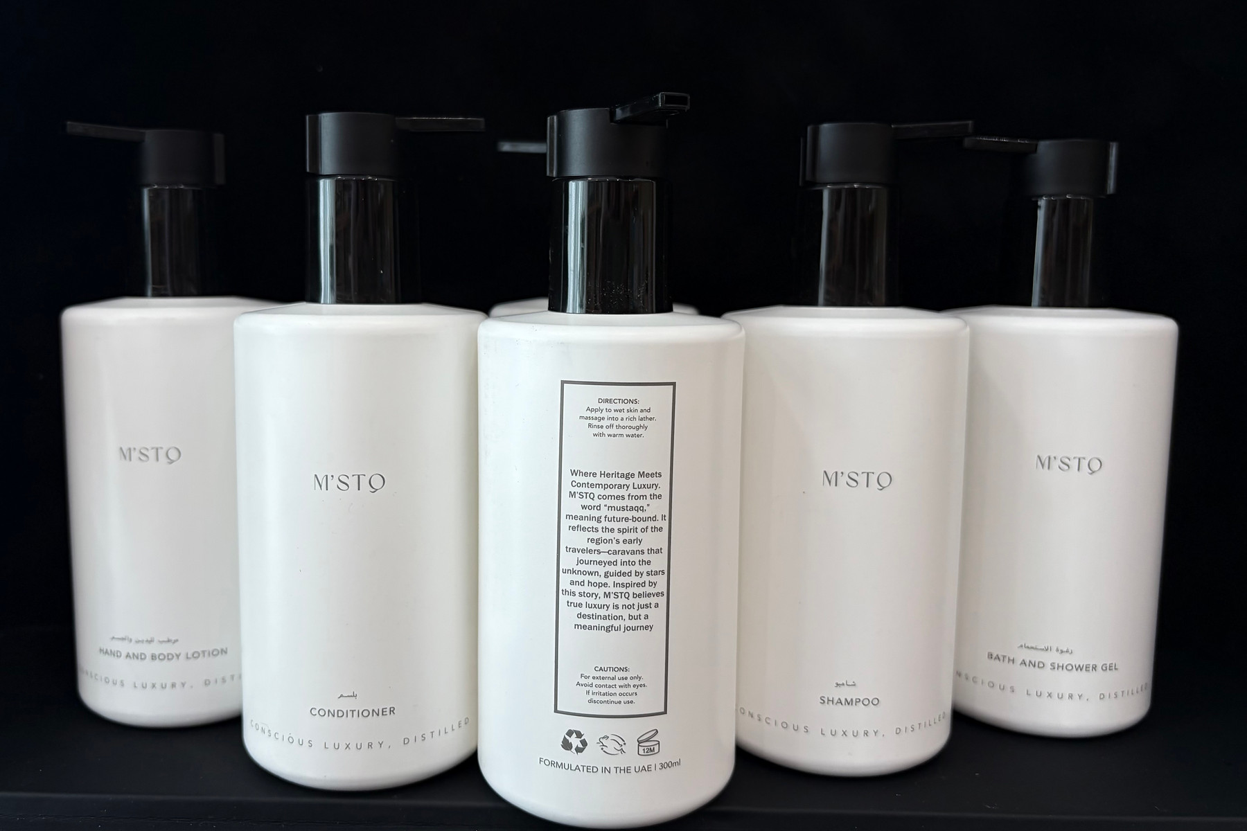 M&rsquo;STQ 300ml hand and body lotion, conditioner, shampoo and bath and shower gel dispensers, each labelled in Arabic and English