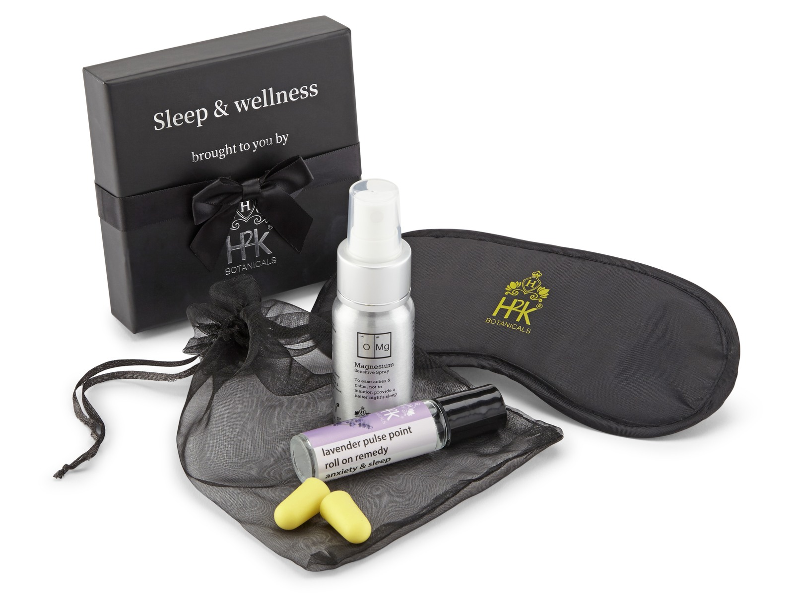 The H2K Sleep & Wellness turndown box — magnesium sensitive spray, lavender pulse point roll-on for anxiety and sleep, a branded eye mask, ear plugs and an organza pouch
